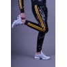 Mr Riegillio PVC Tracksuit Pants Yellow Stripes pantaloni tuta in PVC lucido con righe