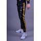 Mr Riegillio PVC Tracksuit Pants Yellow Stripes pantaloni tuta in PVC lucido con righe